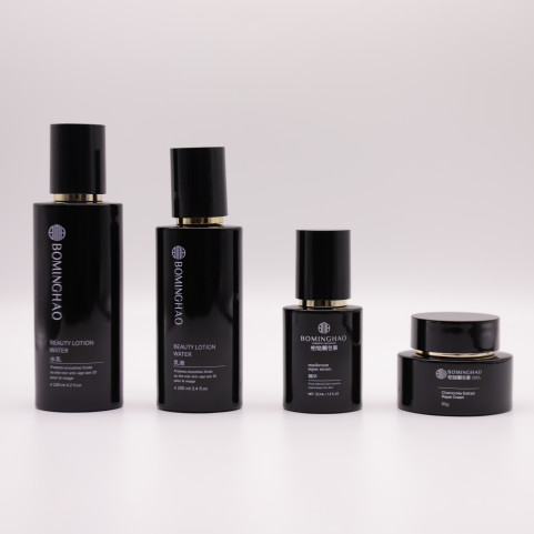 Luxury Black Round Shape Glass Cosmetic Lotion Cream Skincare Bottles Packaging Set with Pump