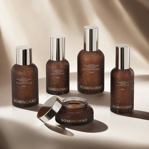 Unique Brown Textured Glass Bottle Round Slhape Cosmetic Airless Bottle Cosmetic Packaging Glass Bottle With Gold Plastic Cap