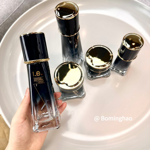 OEM ODM Custom Luxury 100ml 120ml Cosmetic Oil Skin Care Cream Personal Care With White Gold Black Round Glass Bottle